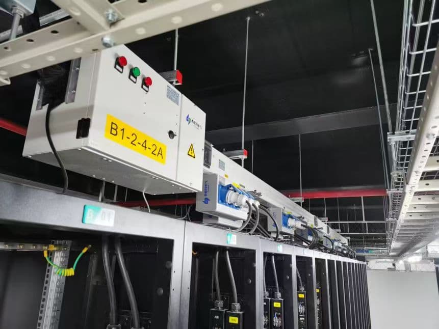 Data center fire-resistant busway installed above server aisles